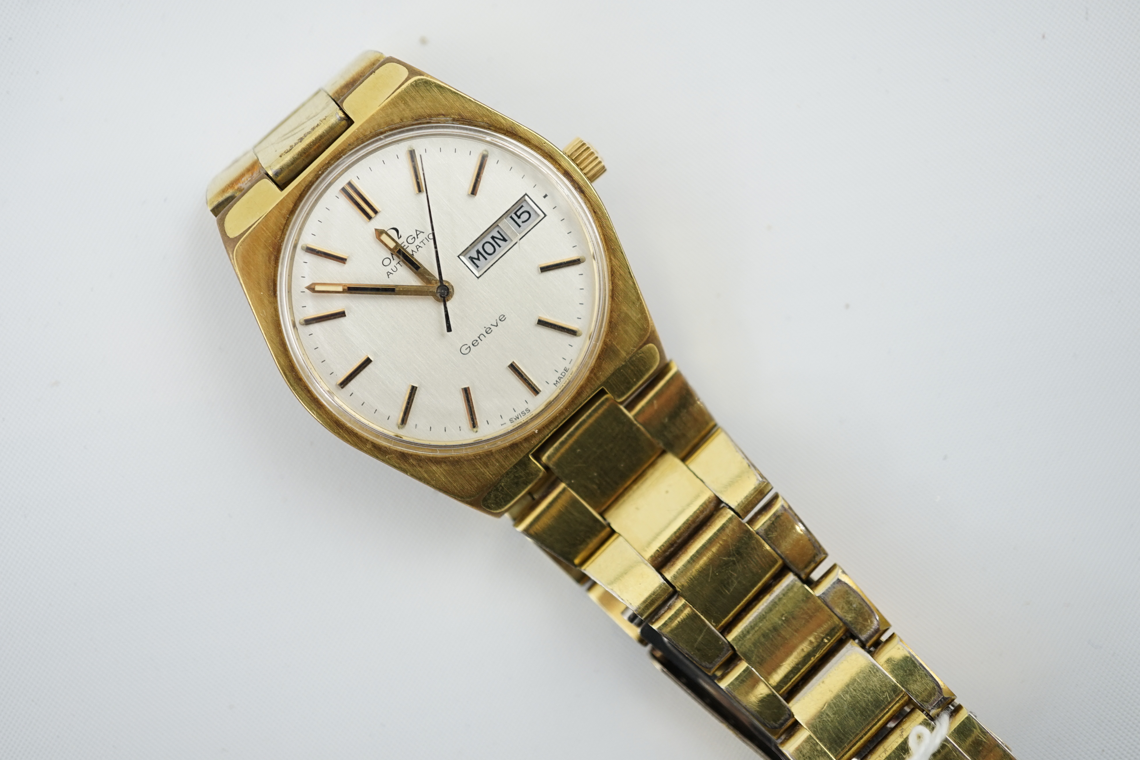 A gentleman's 1980's steel and gold plated Omega Day Date automatic wrist watch, on a steel and gold plated Omega bracelet